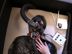 Perverted mistress is torturing slave gimp with electro shocks