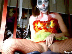 Callie Cobra dresses as a frightening clown and pleasures herself