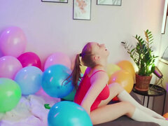 Balloon popping teaser shows her big naturals as well