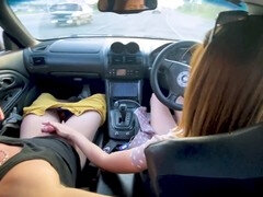 Engaging in dirty talk, she sucks her lover's stiff rod in the car before taking a deep drilling