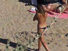 young model topless beach shower sunbathing sunglasses