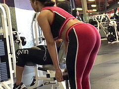 mixed girl with big bum in latex at the gym