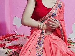 Hot Indian bhabhi in red saree gets seduced in a corner