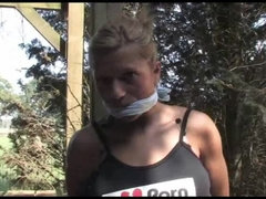 Hottie tied and cleavegagged outside