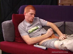 Redheaded Tristian hot to jerk off: cute young guy naked stroking his cock and gyrating on the couch