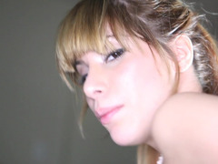 A Latina with large natural tits is shaking a large dick