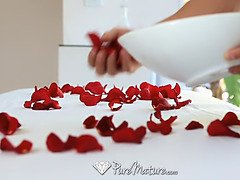 Sensual massage on a bed of roses for Kiera King