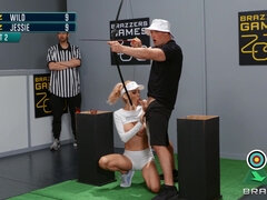 Sarah Jessie is sucking Zac's cock while he is aiming for the target