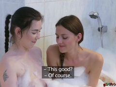 Lesbian girlfriends Daphne and Kira get naughty in the tub.