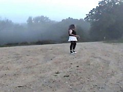 Sandy undresses on dirt road