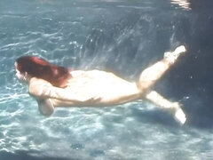 An awesome BBW babe Cherry Brady swims in the pool with boobs naked