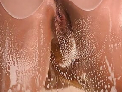 Sexy chick with a sexy booty in the shower exploring her body