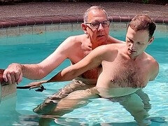 Dad JT gives it to the pool boy underwater