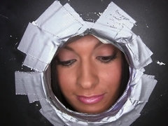 A nasty chick is licking and fucking five dicks inside a glory hole