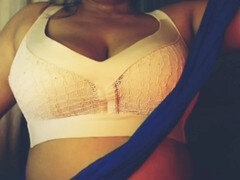 Naughty girl enjoys revealing her amazing boobs and playing with them seductively
