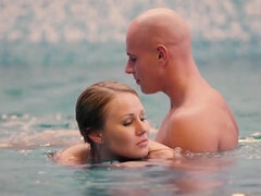 Teen swims in a pool and meets the bald guy to make it