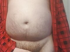 Fat boy teasing in a robe