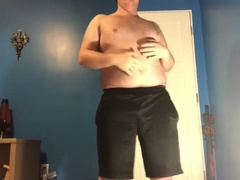 Fat boy shows off his curves.