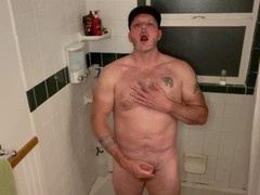 Muscular dad peeing and stroking in the shower