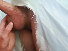 Filling the cocksucker's mouth at the homemade glory hole
