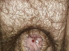 Small hairy cock leaking while riding a toy