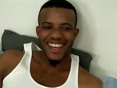 Black gay stud relaxes while a white guy strokes him