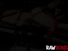 Chained jock lying face down being fisted in his ass