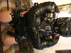 Straitjacketed slave is suspended