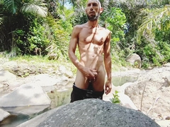 Getting Off by a tropical sea and large and gigantic popshot on a stone