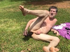 Doug Stratemeyer enjoys outdoor anal play with ass plug and dildo