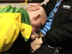 Sucking off his mate's dick in public.