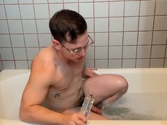 Twink Danny Wilcoxx gets off using a double-ended glass dildo