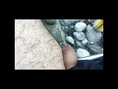 Man peeing on the river