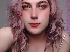 Uber-cute sissy twirling mini-skirt while sneering at camera