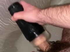 Young fur covered parent plays with flashlight in douche