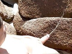 Famous football player is caught pissing on the beach