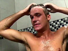 2 wild heterosexual hunks taking a shower together