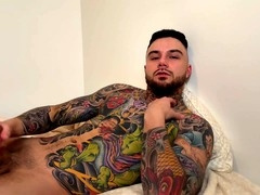 Sensual gay vibes with a hot tattooed guy enjoying a slow handjob