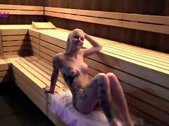 Blonde chick with tattooed body from sauna in sex movie