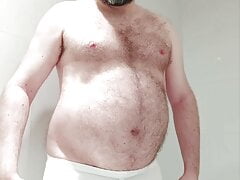 Chastity locked bear pisses his pants and gives himself a wedgie