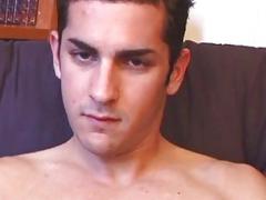 Muscled guy rubs his gay cock and fingers his asshole