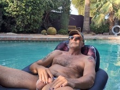 Gay pool, ballcap, poolside