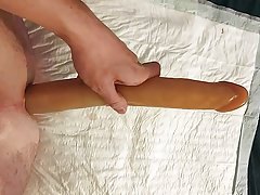 Extreme long dildo in young asshole.