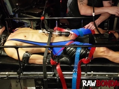 Dungeon master punishes jock in gas mask and cock pumping