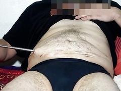 Sticking rod through stomach fetish while masturbating