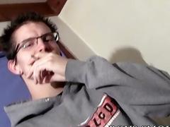 Cute twink with glasses smokes and tugs on his boner
