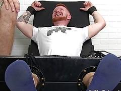 Bearded stud with red hair restrained for naughty tickling domination