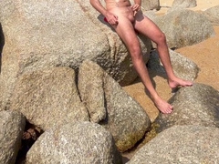 Draining off on the beach in thailand and nutting in the water. Public masturbate off