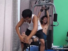 Muscular Asian guy tickled at the gym like an idol
