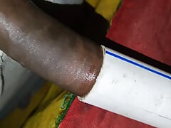Indian boy at home having fun with conduit pipe and cumming inside it